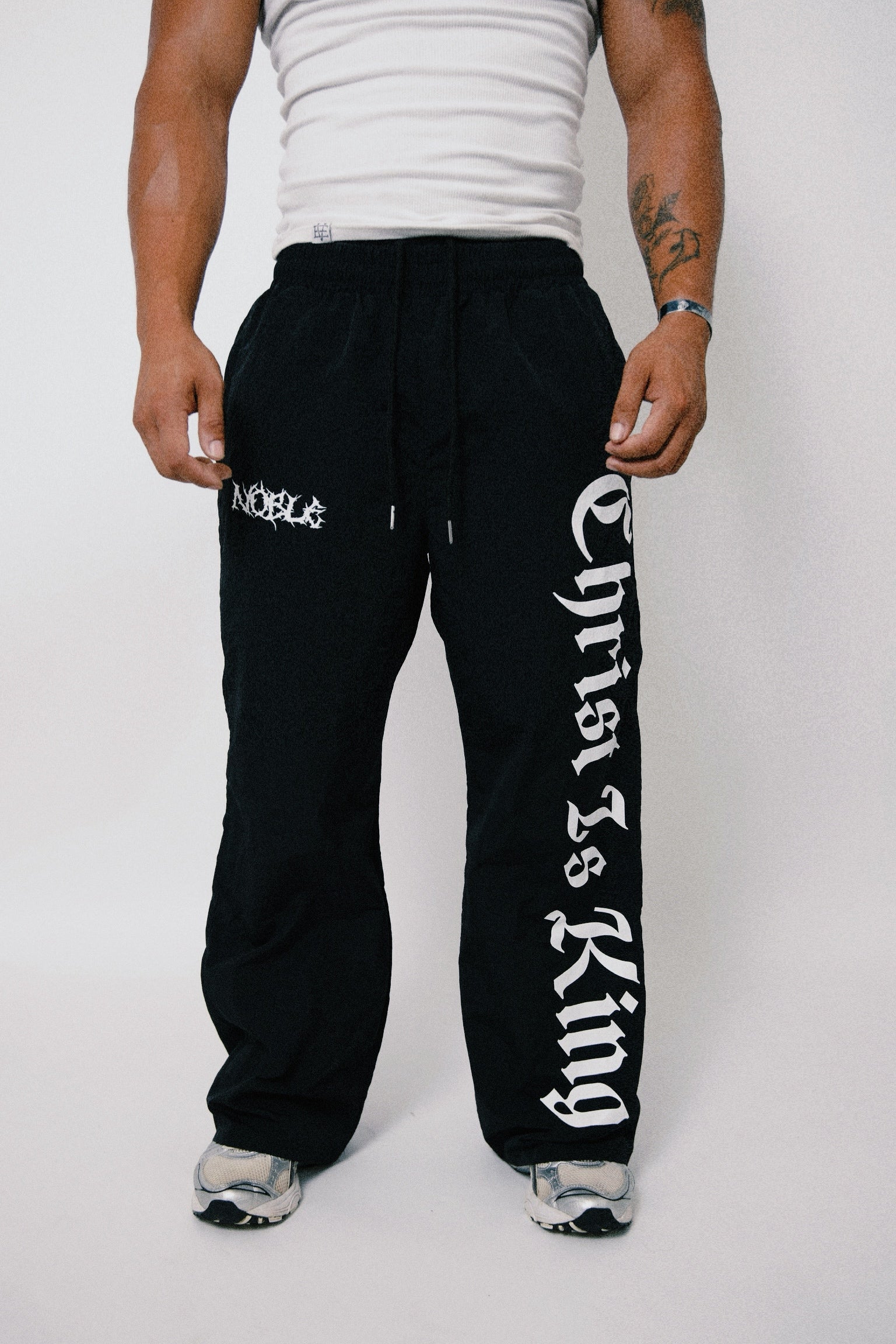 CHRIST IS KING BAGGY TRACK PANTS
